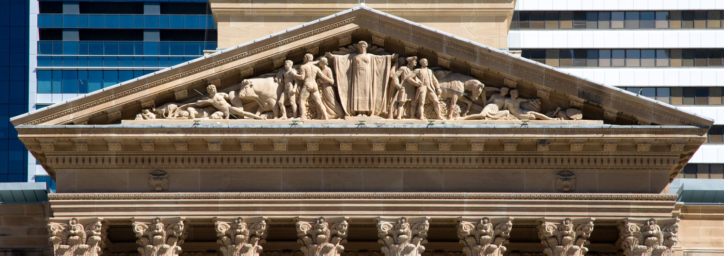 The tympanum on Brisbane City Hall carved by artist Daphne Mayo.
