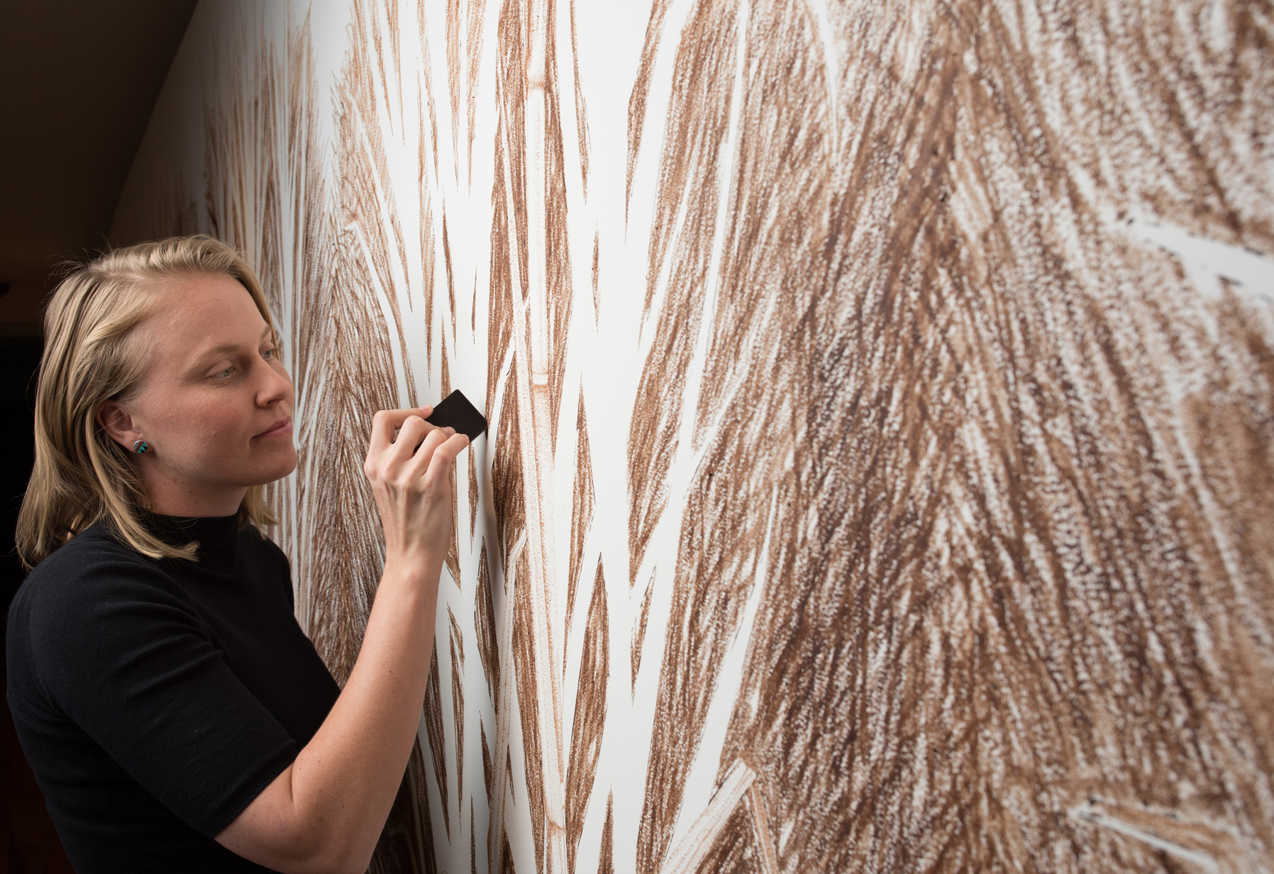 Elizabeth Willing during installation of her work at Museum of Brisbane, 2017.