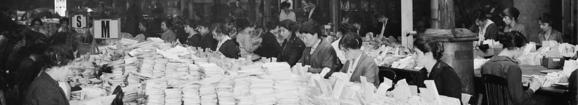 Women in the first world war with piles of letters