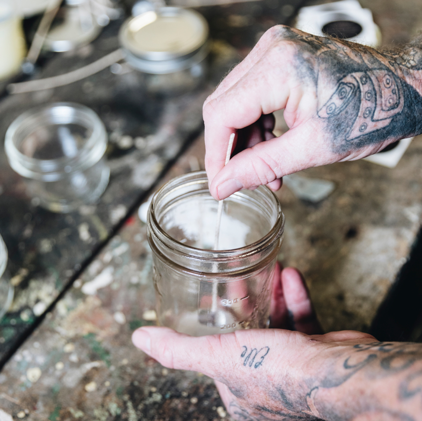Wick being placed in wax