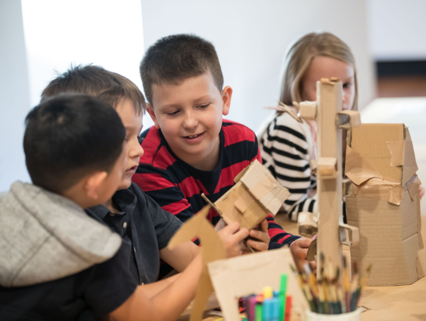 Children making cardboard projects
