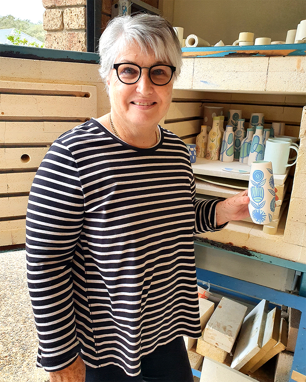 Ronelle Clarke opening kiln