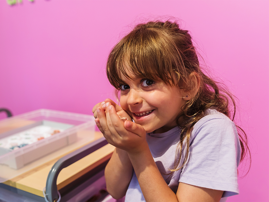 Young girl interacting with the touch trolley in the museum
