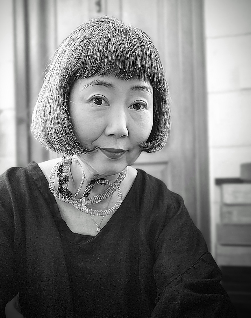 Black and white portrait of the designer, Mika.