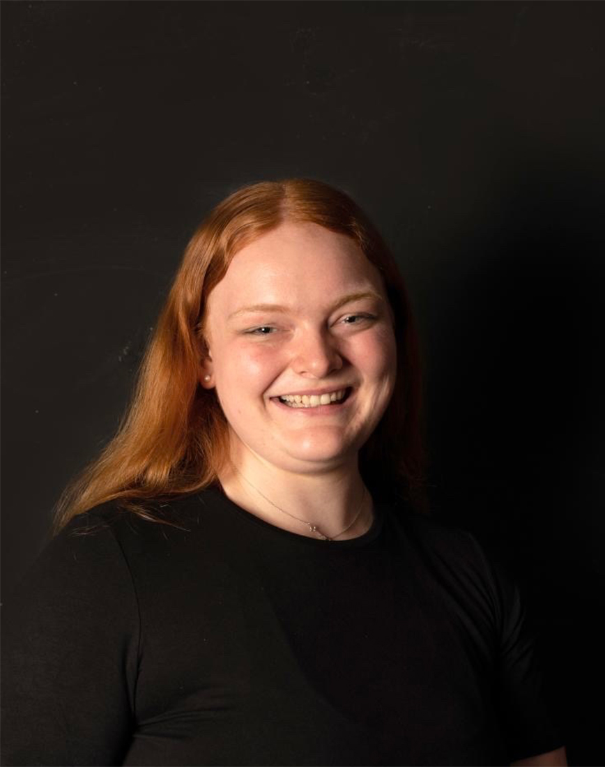 A headshot of a girl smiling.