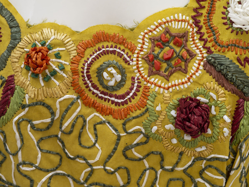 Close up of the bodice of the Eastern Pearson RAQ Awards 2004 dress, featuring raffia cornelli type embroidery.