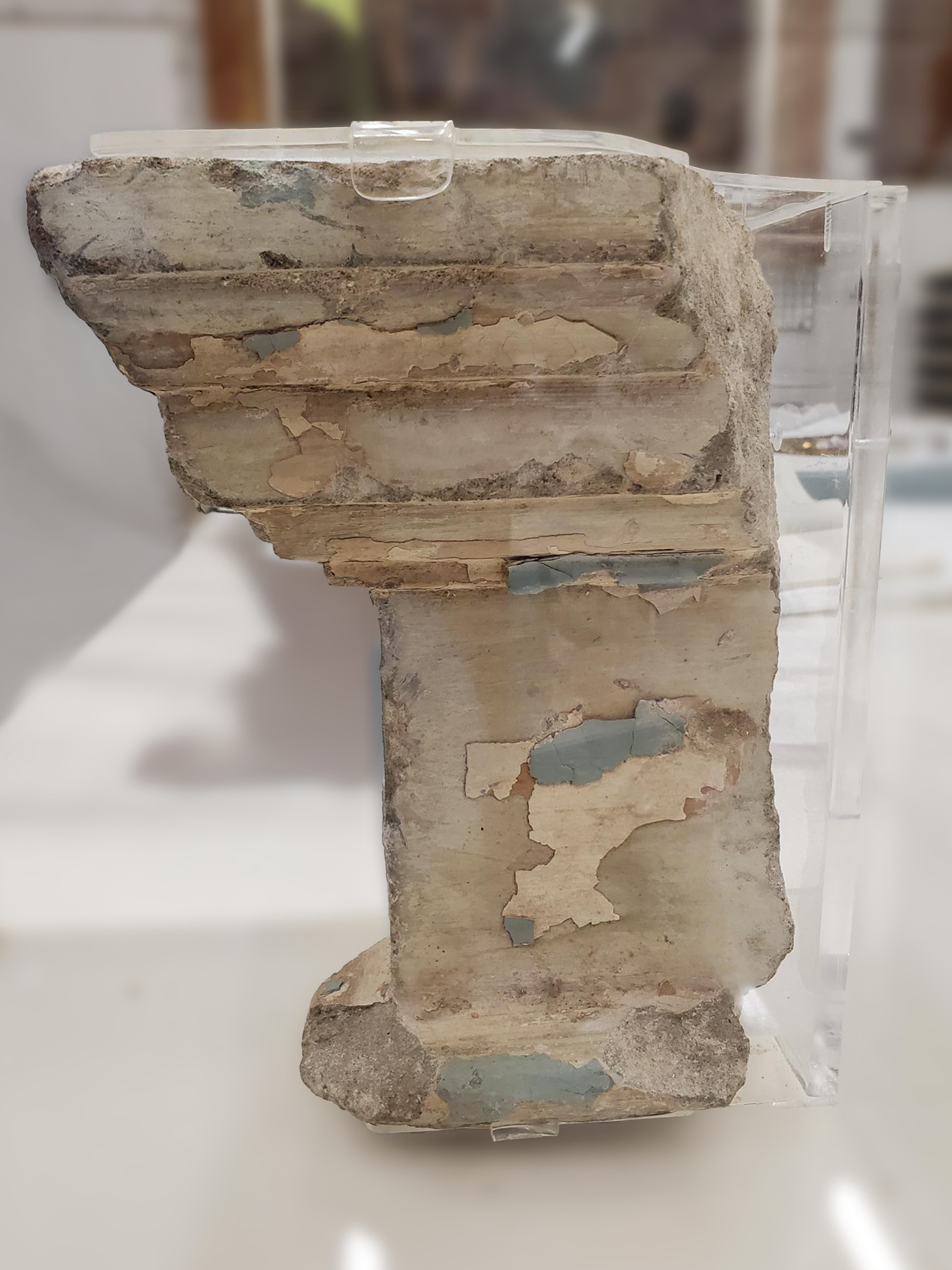 Relic of Bellevue Hotel building - masonry with blue and white paint and plaster.