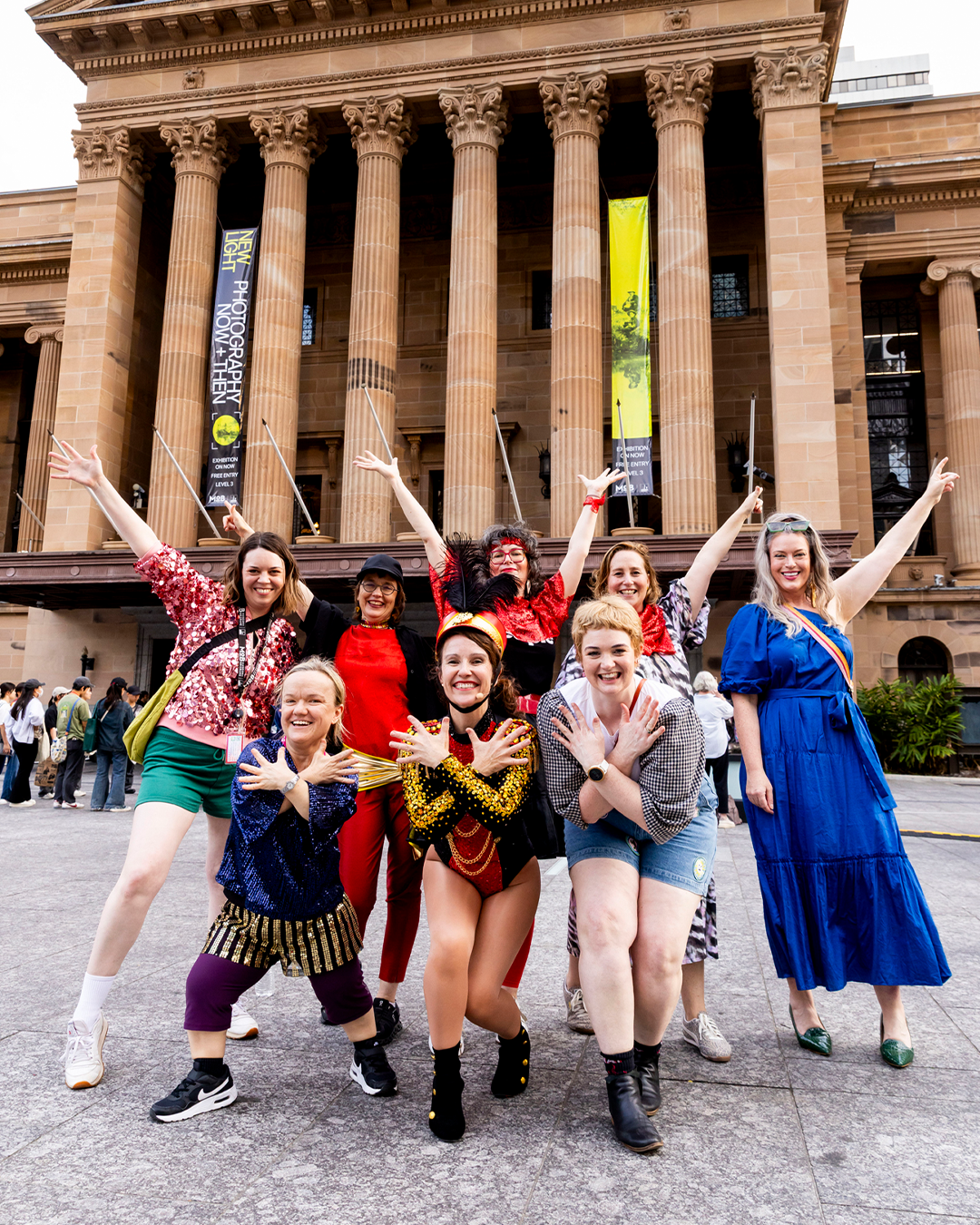 A group of people posing in front of the camera.