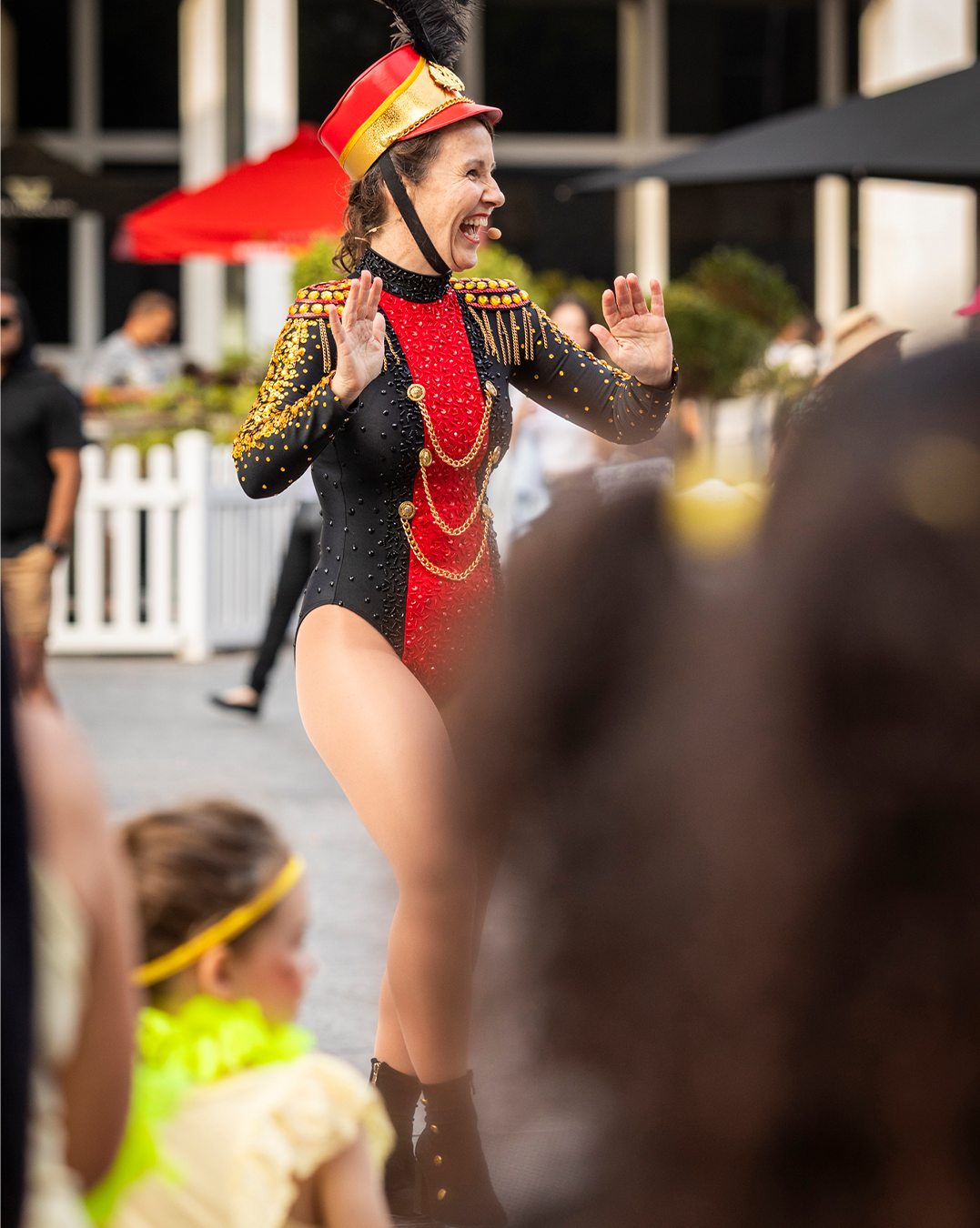 A woman in show biz clothes, dancing.