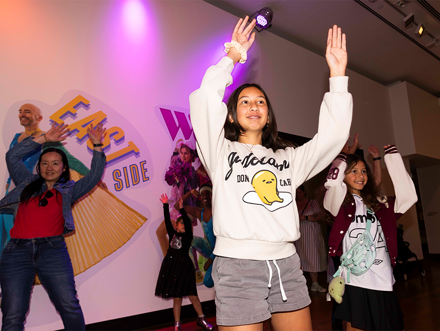 A woman holding her hand high