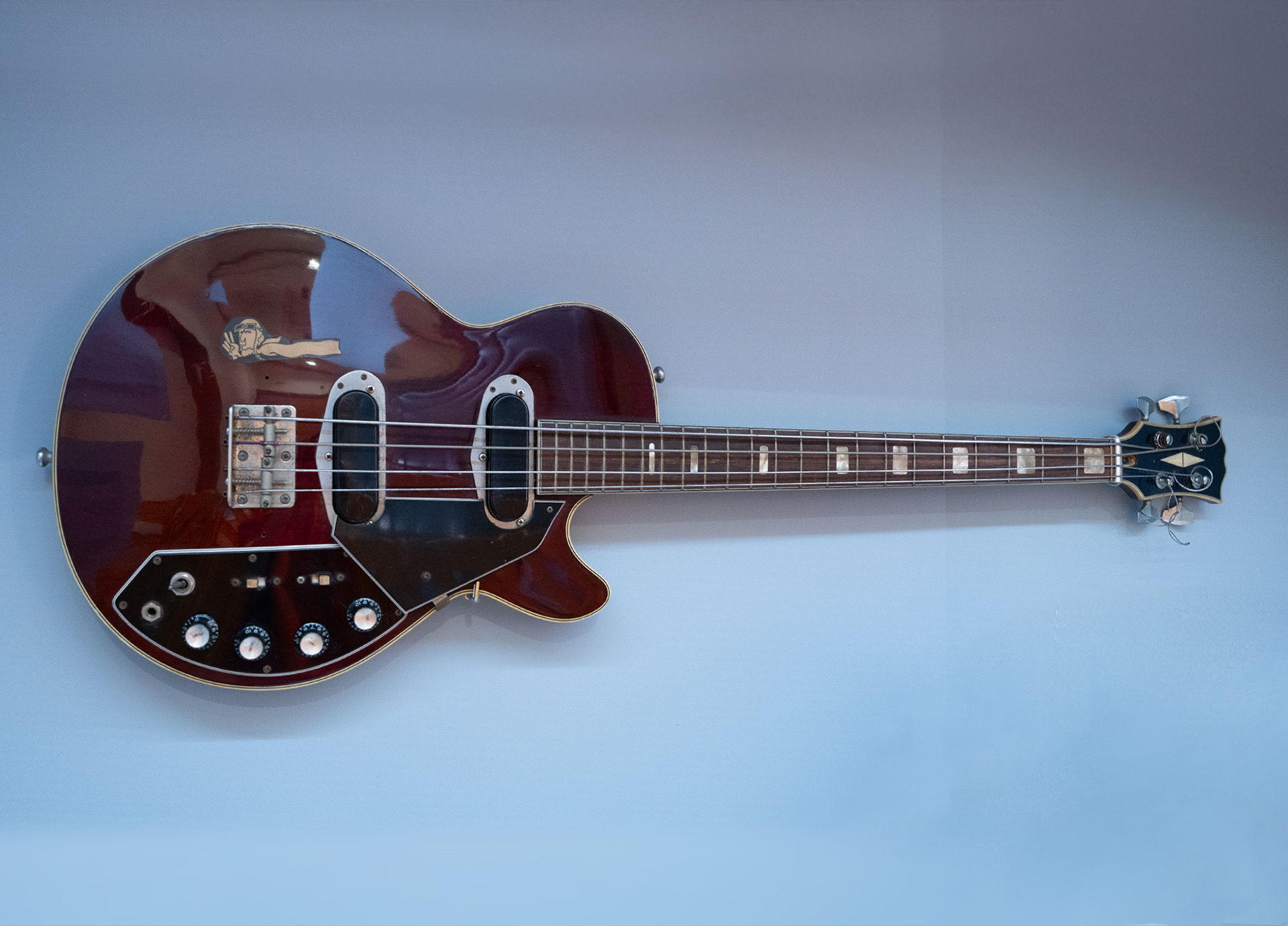 Brown electronic guitar.