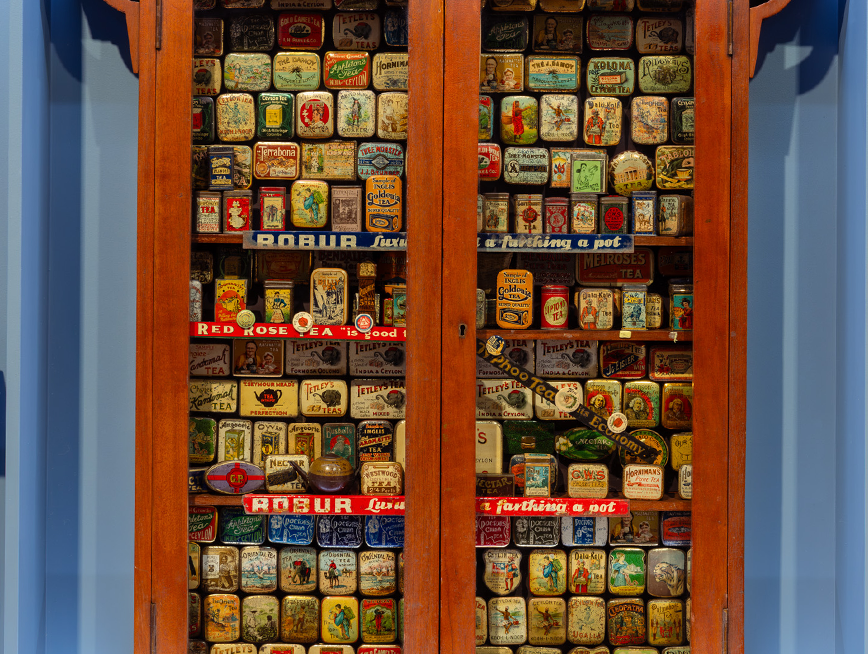 A cabinet of tins.