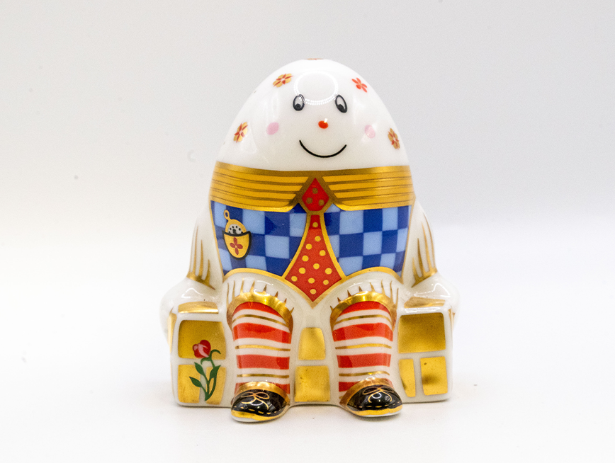 A smiling egg figurine.