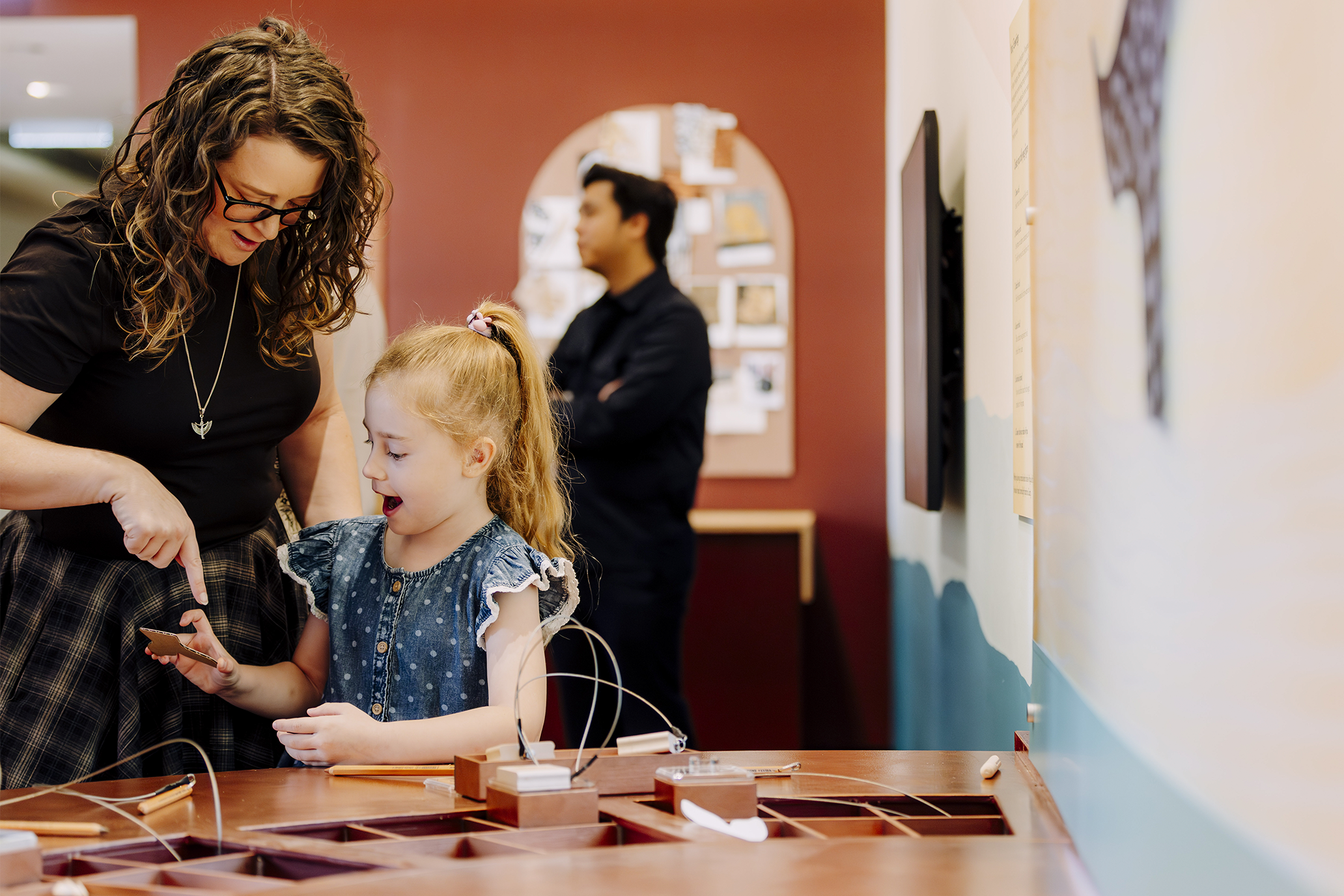 Mum and girl at the activity table.