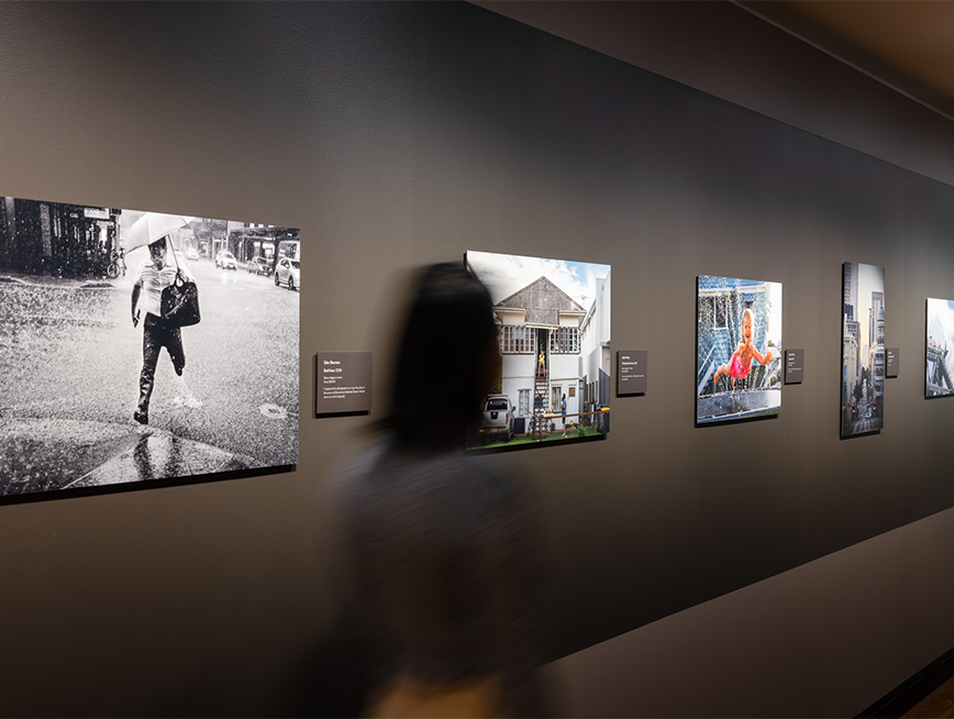 A visitor viewing photographic works at the Lord Mayor's Photographic Awards 2026.