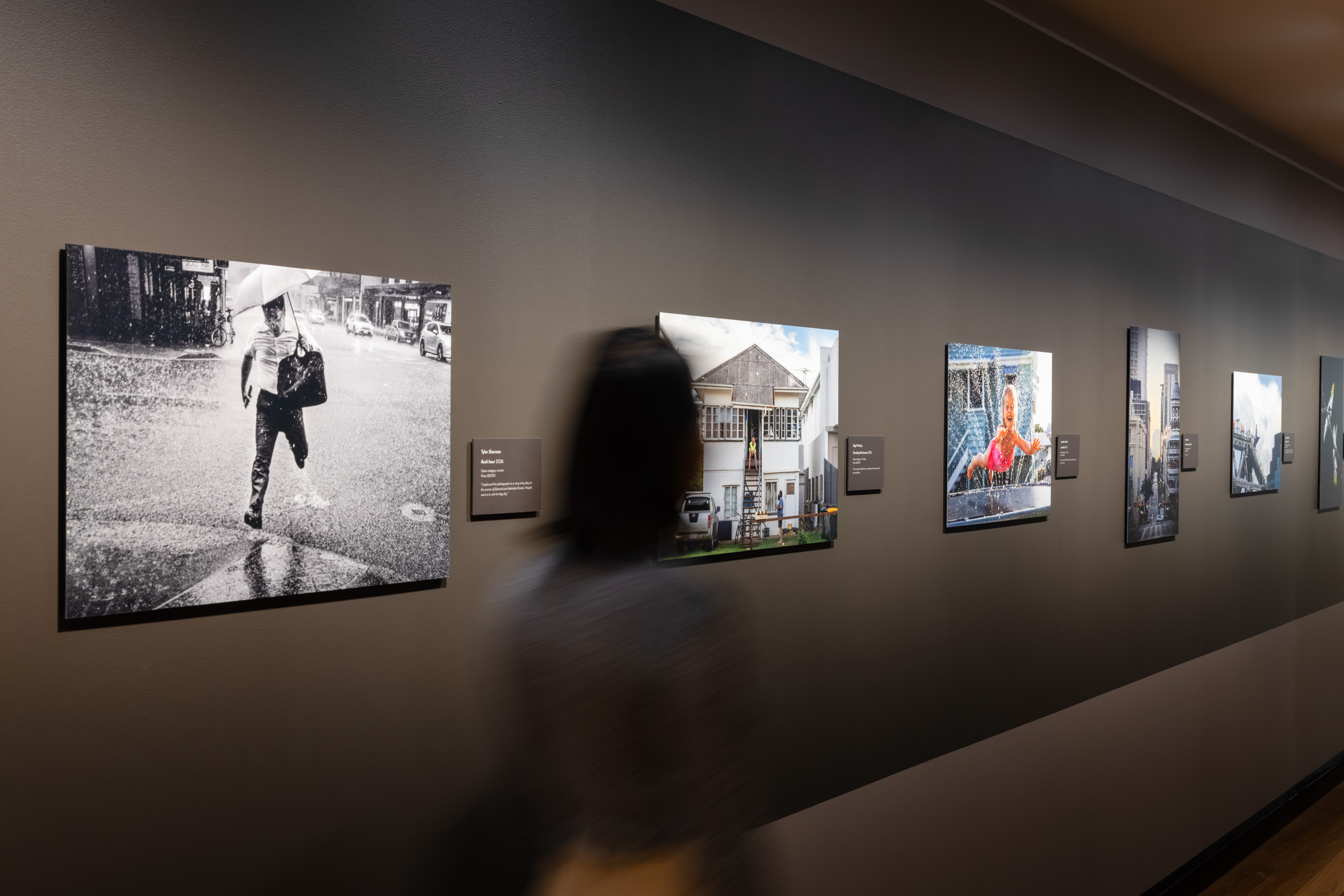 A visitor viewing photographic works at the Lord Mayor's Photographic Awards 2026.