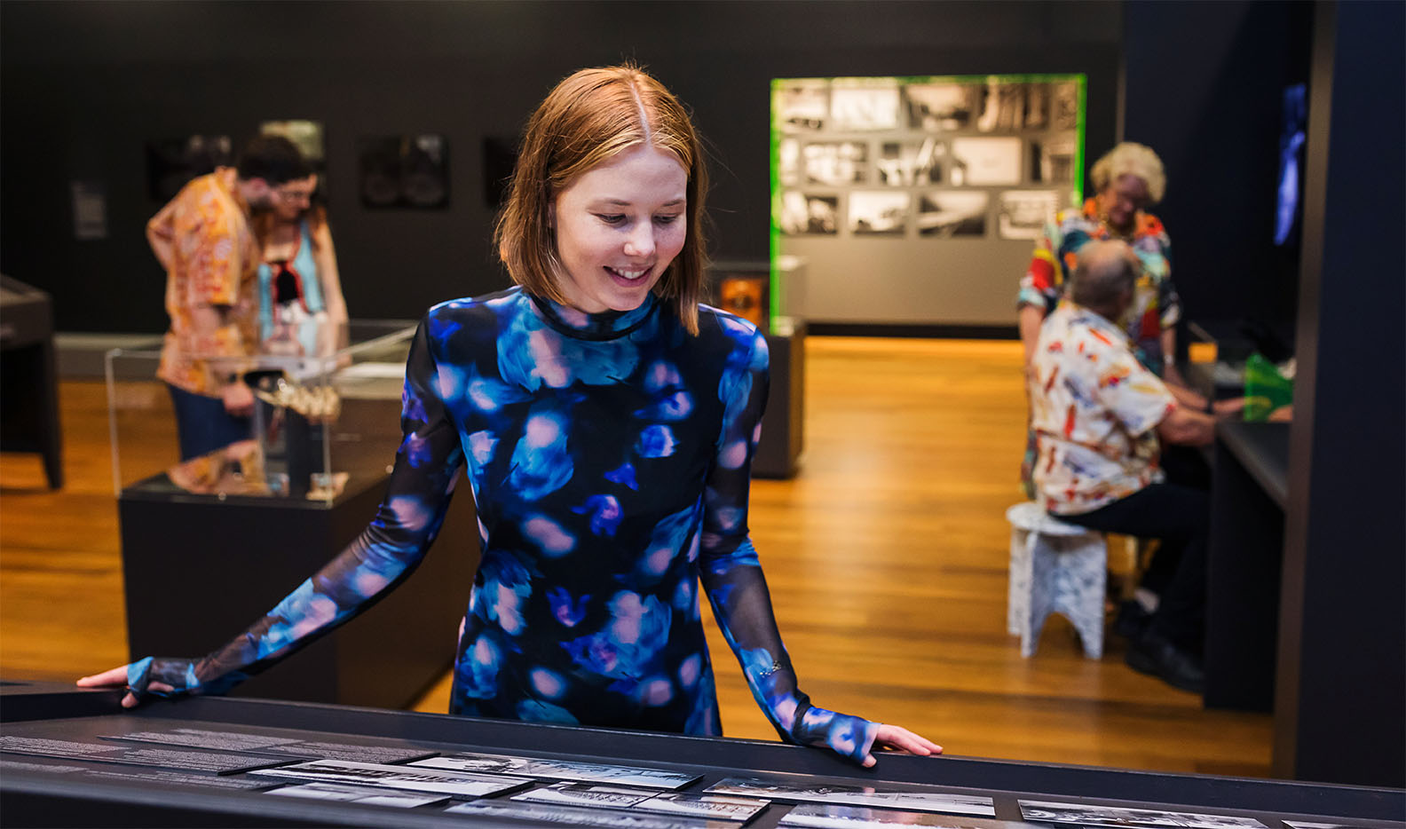 Visitor smiling in exhibition