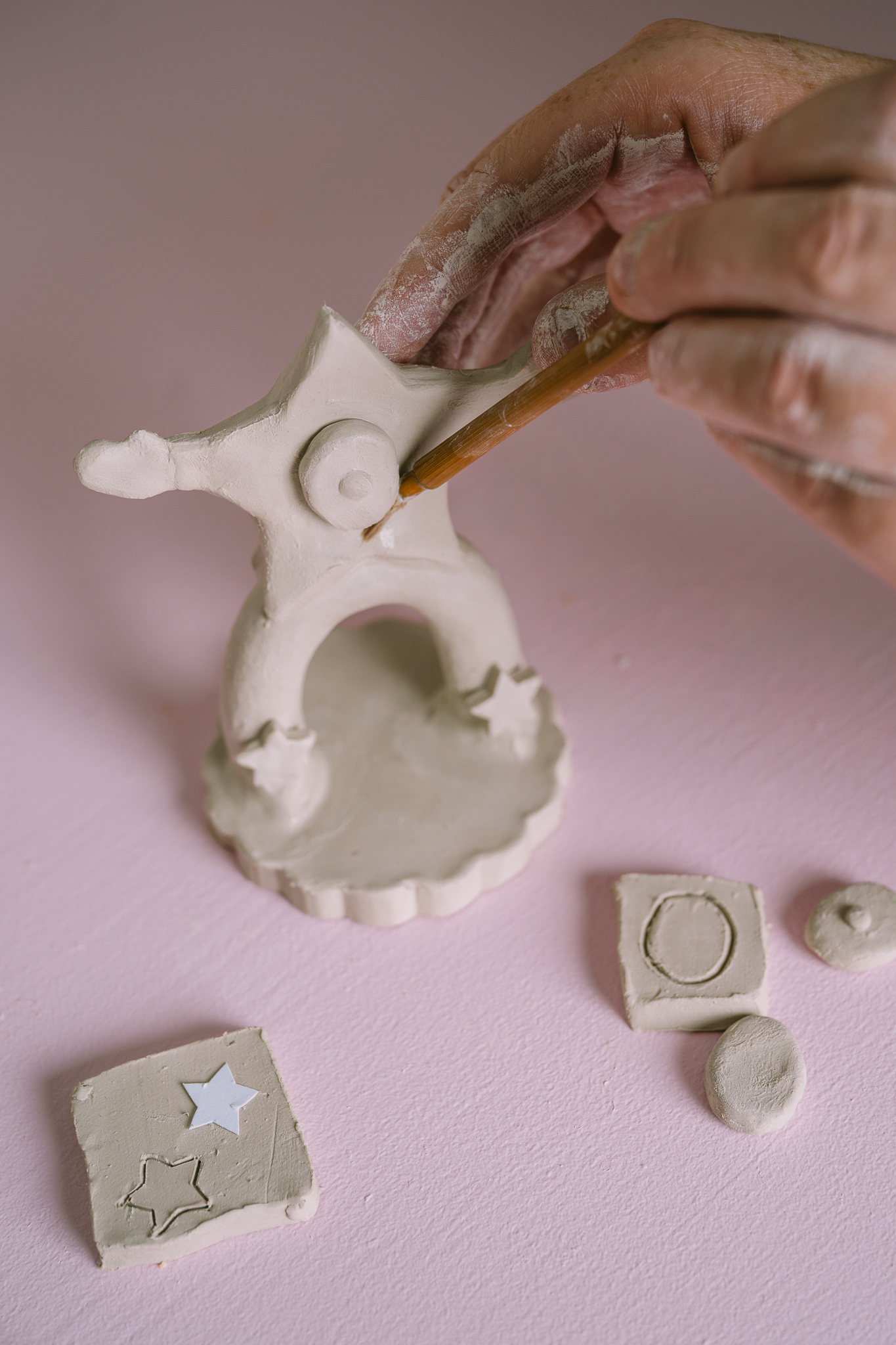 Ceramic in the making, shaped as a star with legs