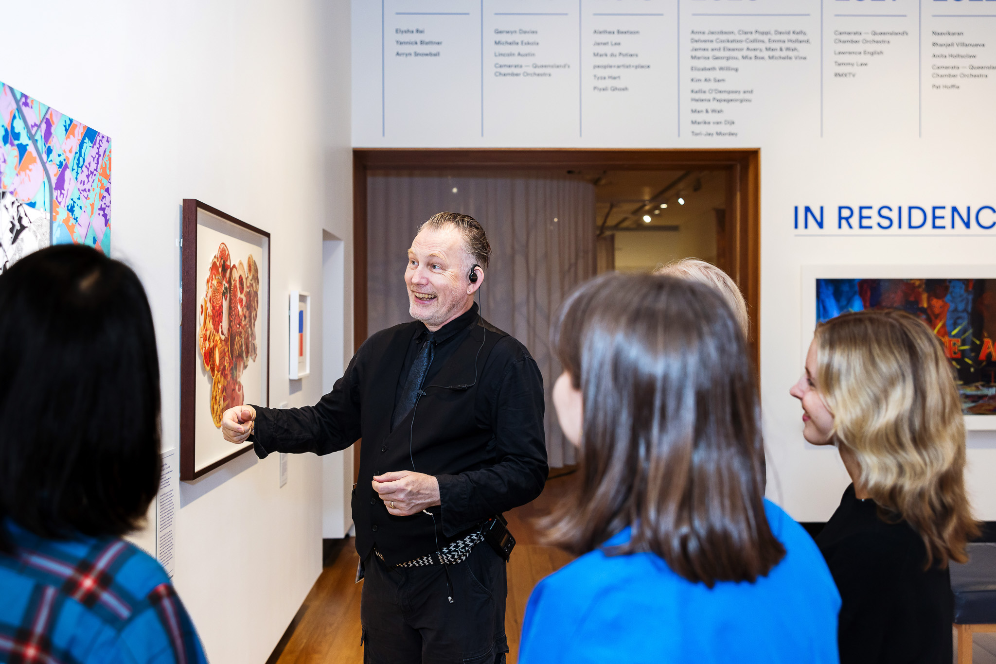 A guide facilitating an exhibition highlight tour.