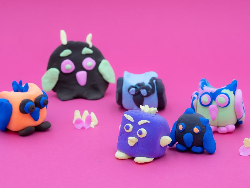 Colourful clay-made mini owls.
